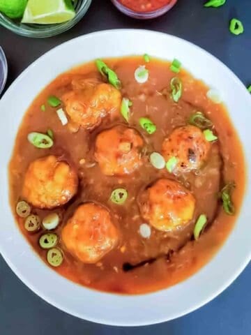 Make this easy Veg Manchurian Recipe with crispy vegetable balls tossed in a spicy, sweet, and tangy gravy. Perfect with fried rice or noodles!