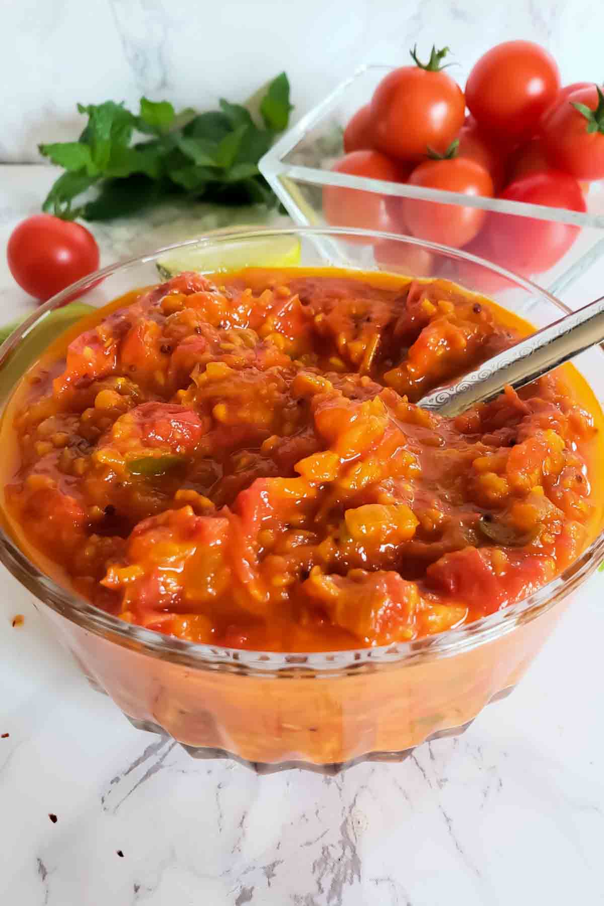 A bowl of tangy and zesty cherry tomato chutney.