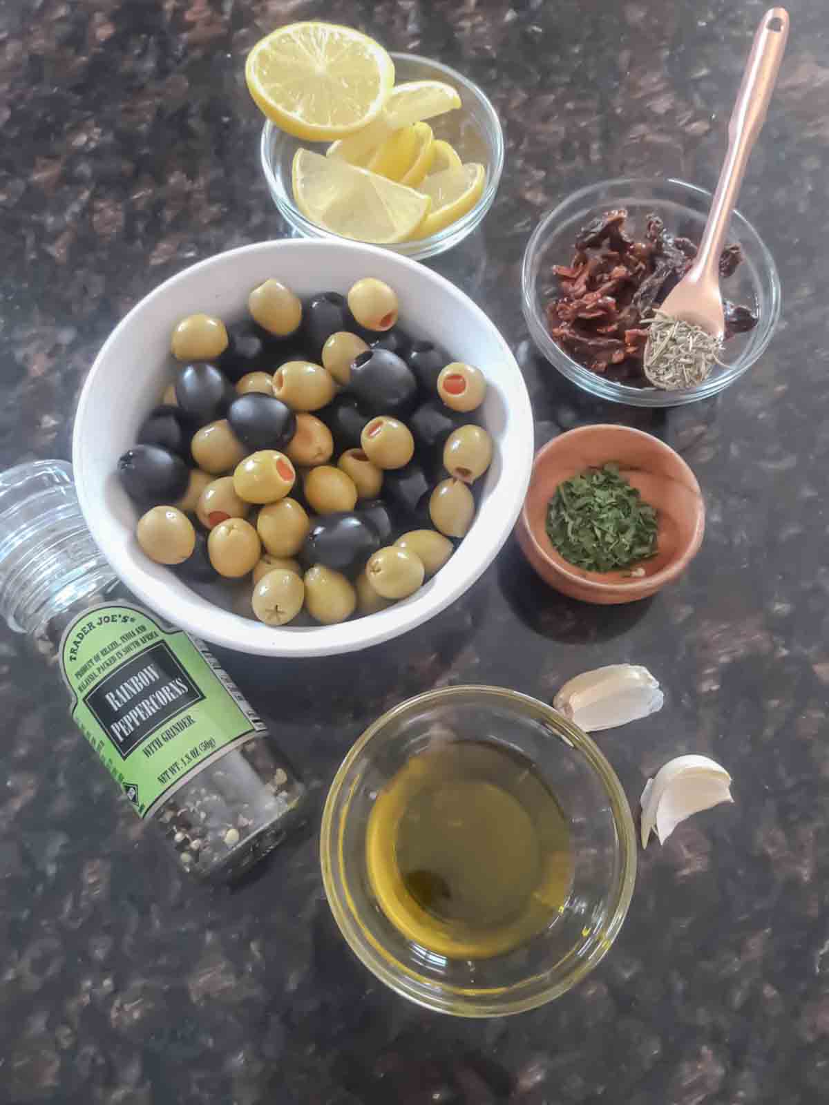 Ingredient display for mixed olive tapenade without anchovies. This tapenade recipe is vegan and gluten-free. 
