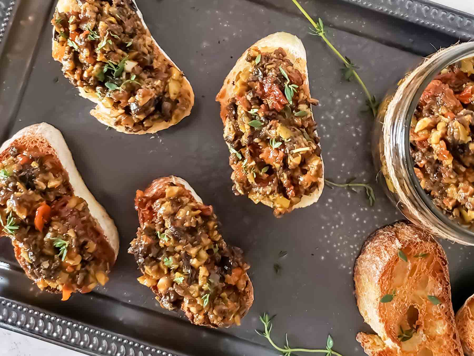 Overhead image of tapenade crostini's served on the tray. 