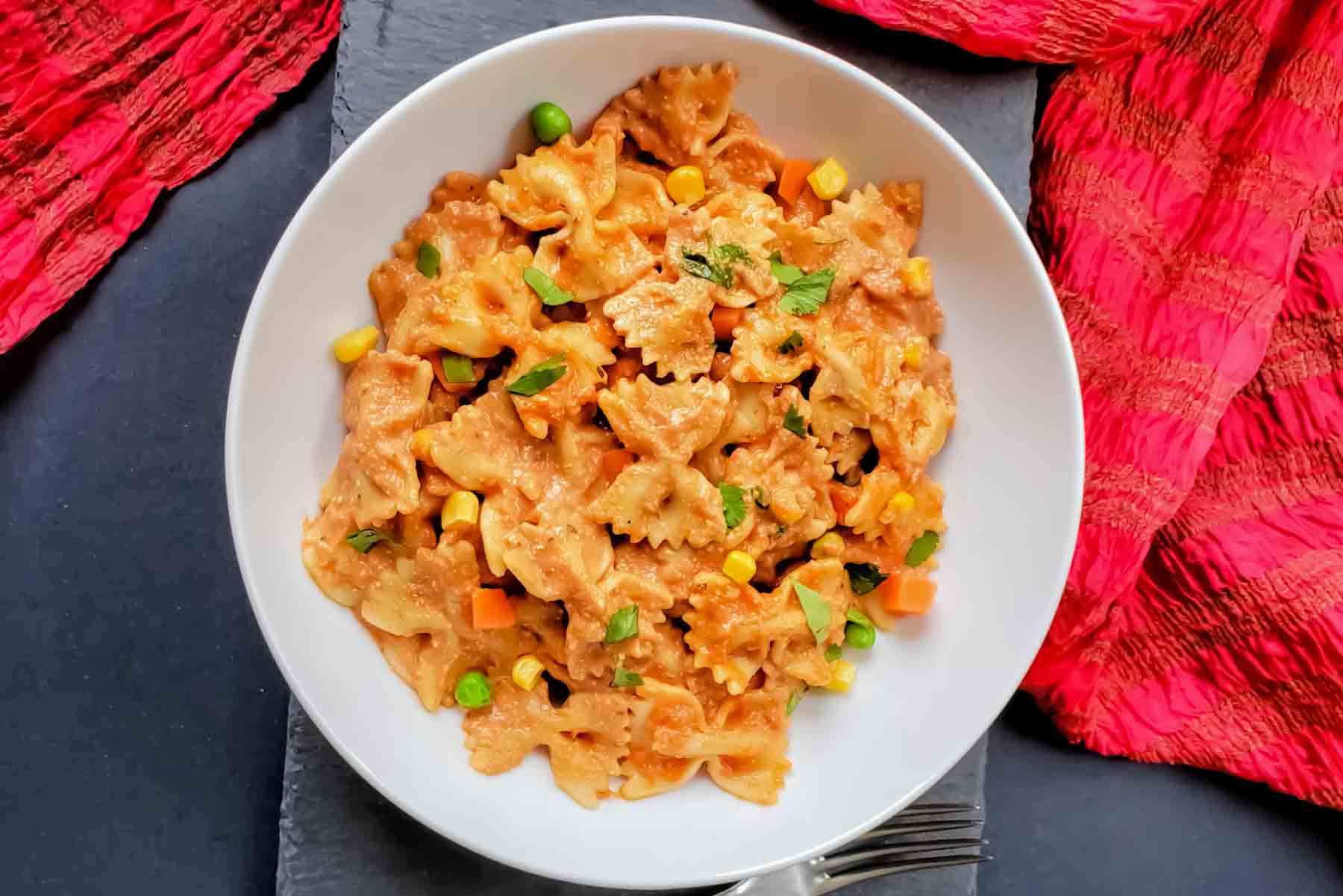 Farfalle Pasta tossed in creamy Indian makhani sauce