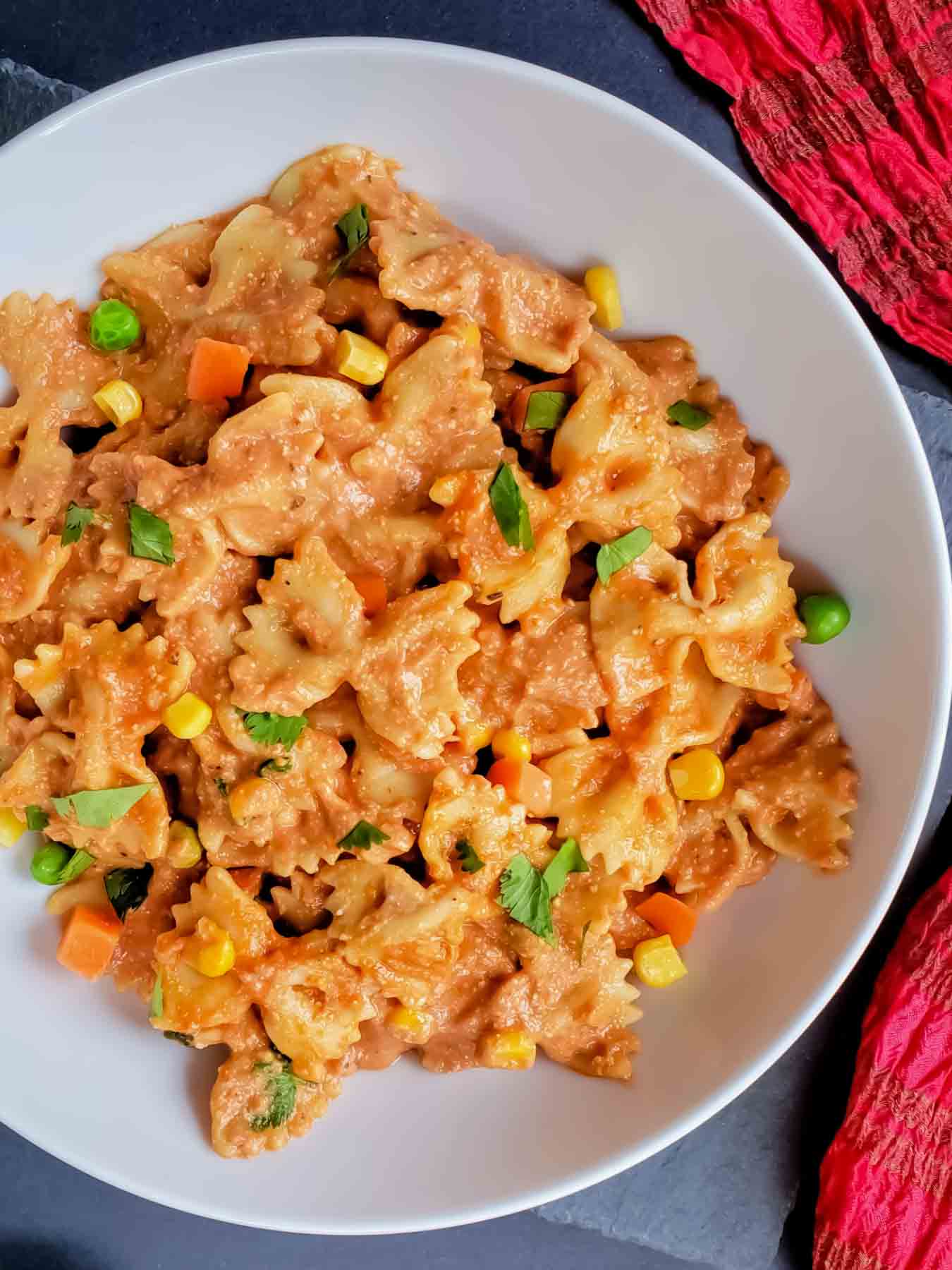 Creamy Makhani Masala Pasta with vegetables and cashew cream.