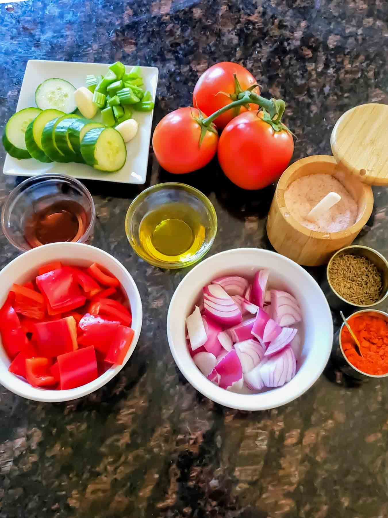 Raw vegetables and seasoning used in making Spanish cold summer soup called gazpacho. 