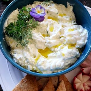 Close up imae of greek tzatziki sauce showing thick creamy texture.