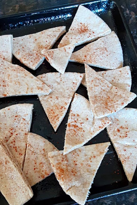 Pita bread cut into triangles and drizzled with olive oil and chili lime seasoning