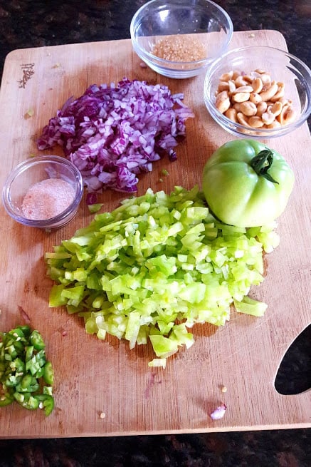 ingredients needed to make fresh green tomato onion salad.