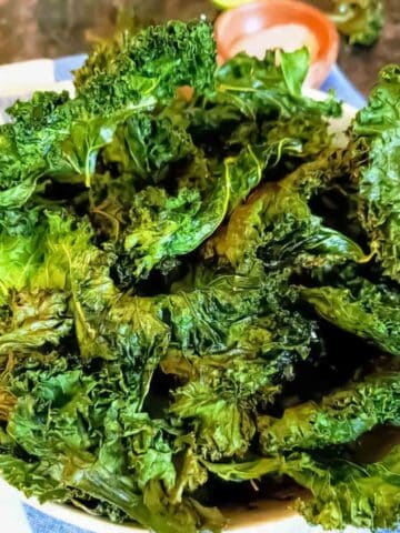 Easy baked kale chips recipe made with fresh curly kale leaves.