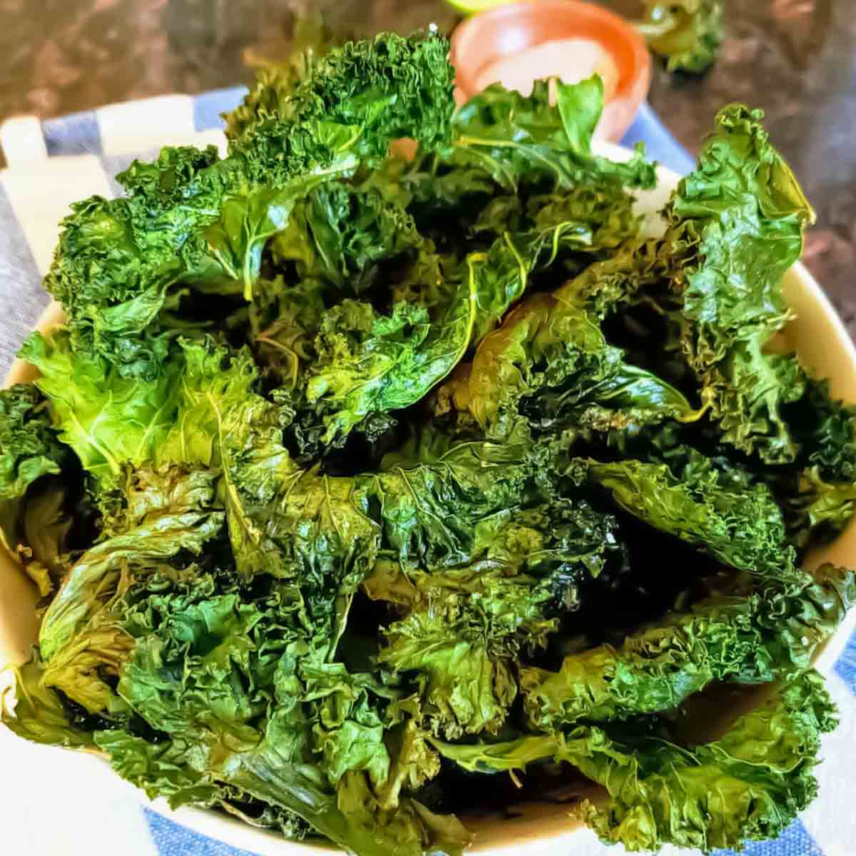 Easy baked kale chips recipe made with fresh curly kale leaves.
