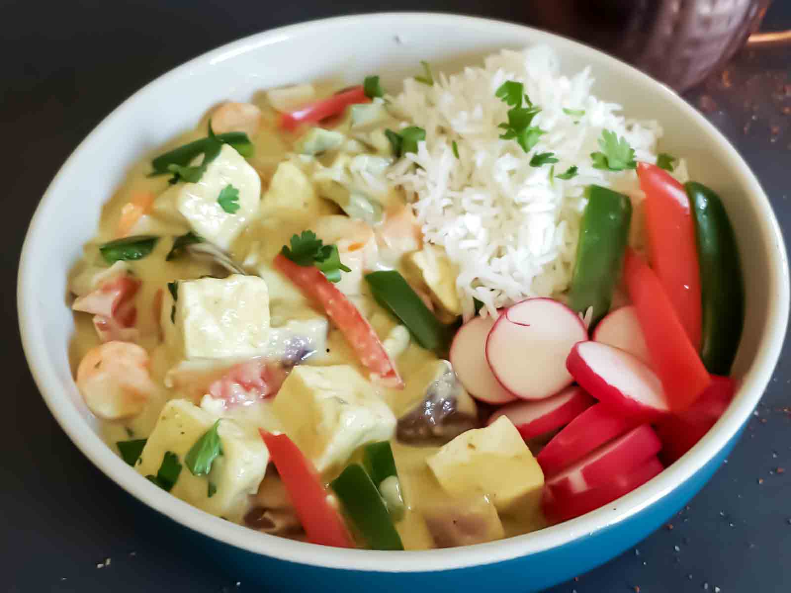 Creamy Coconut Thai green curry with tofu and vegetables. 
