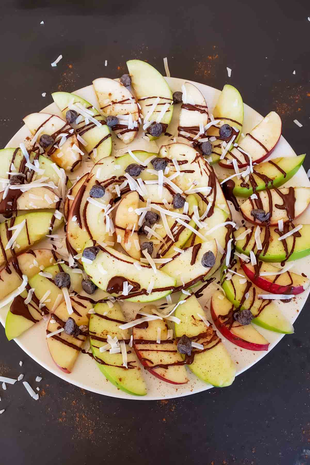 Easy apple nachos recipe with sliced apples and sweet toppings.