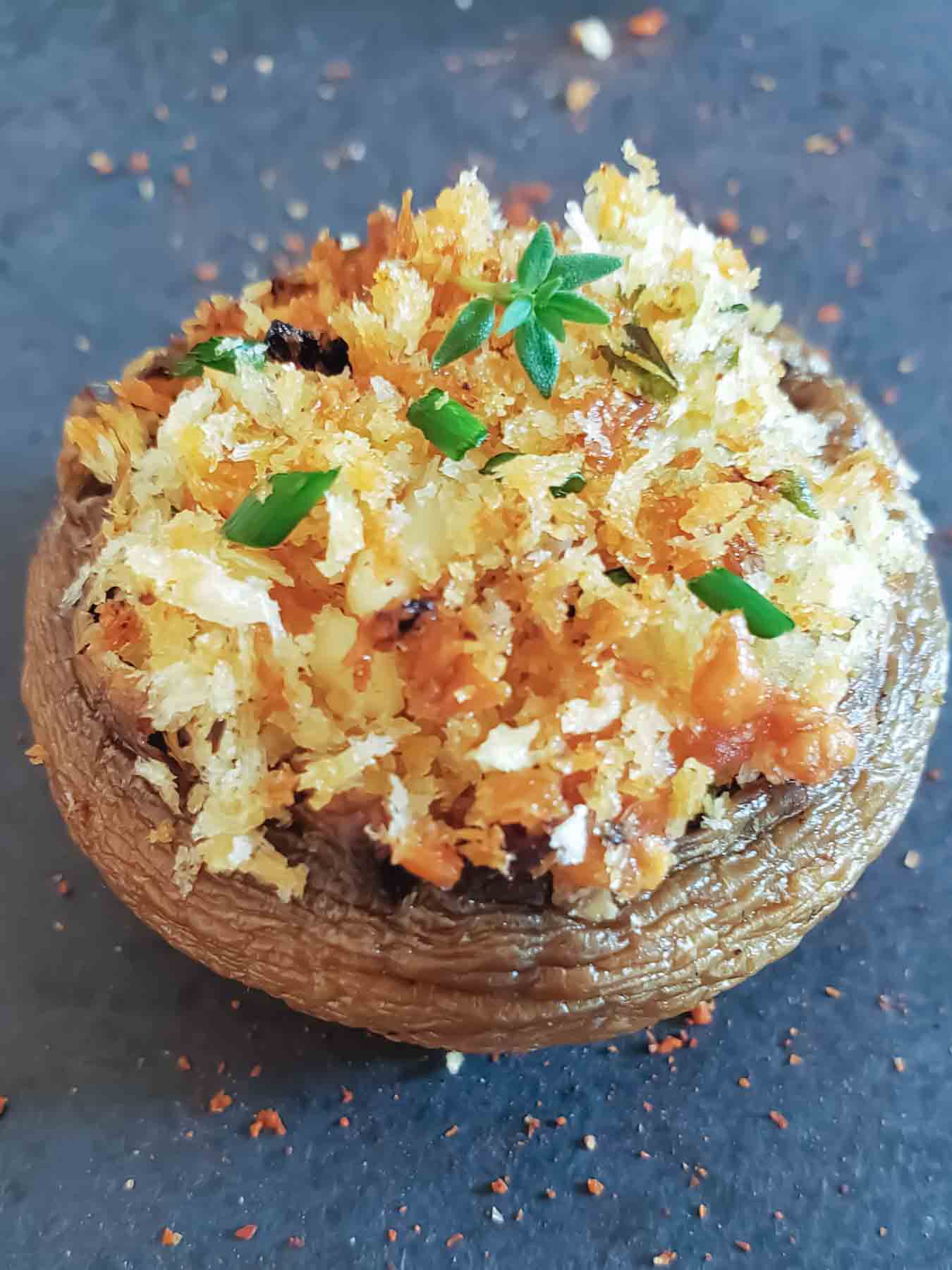 Crispy Parmesan stuffed mushrooms cooked in the air fryer.