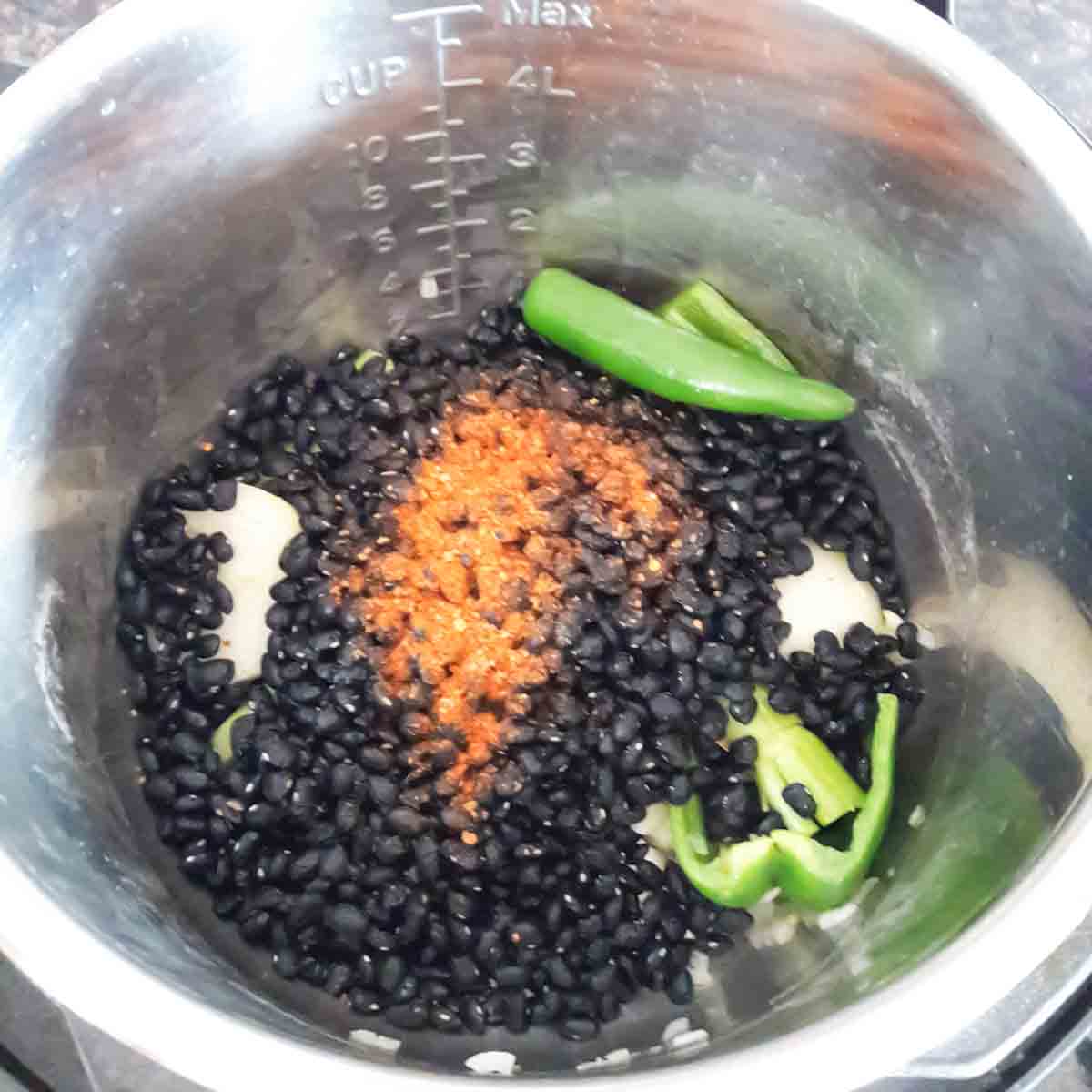Rinsed black beans added in the Instant Pot for cooking.