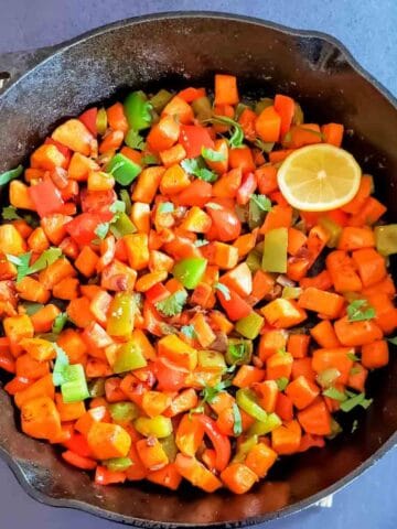 Healthy vegan sweet potato stir fry recipe with colorful vegetables and spices.