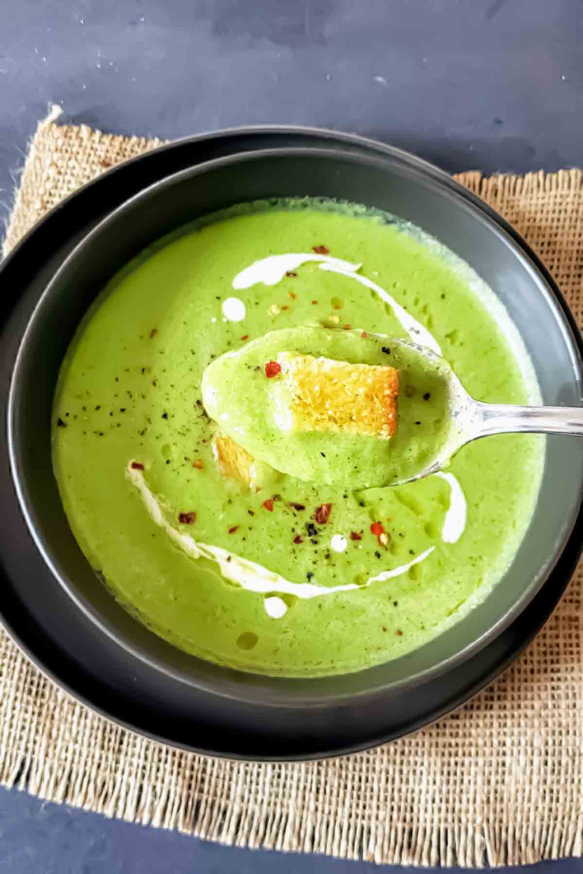 A spoon of velvety Vegan Asparagus Broccoli Soup (No Cream)