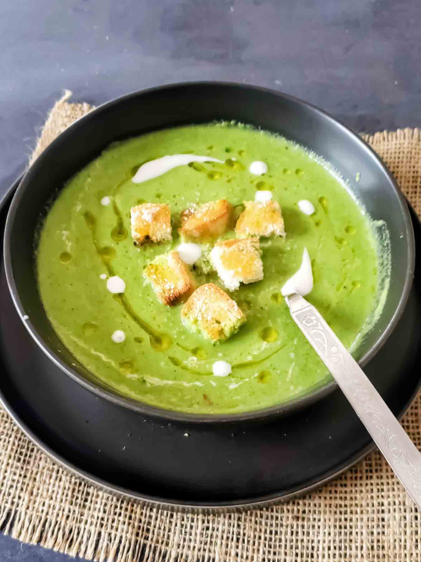 Low-Carb Asparagus Broccoli Soup served with garnishes.