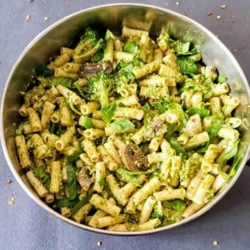 Pasta primavera with pesto, mushrooms and other vegetables.