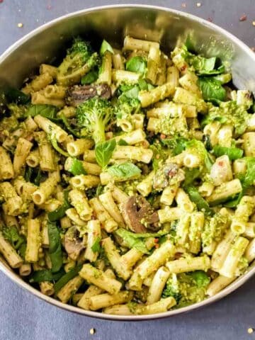 Pasta primavera with pesto, mushrooms and other vegetables.