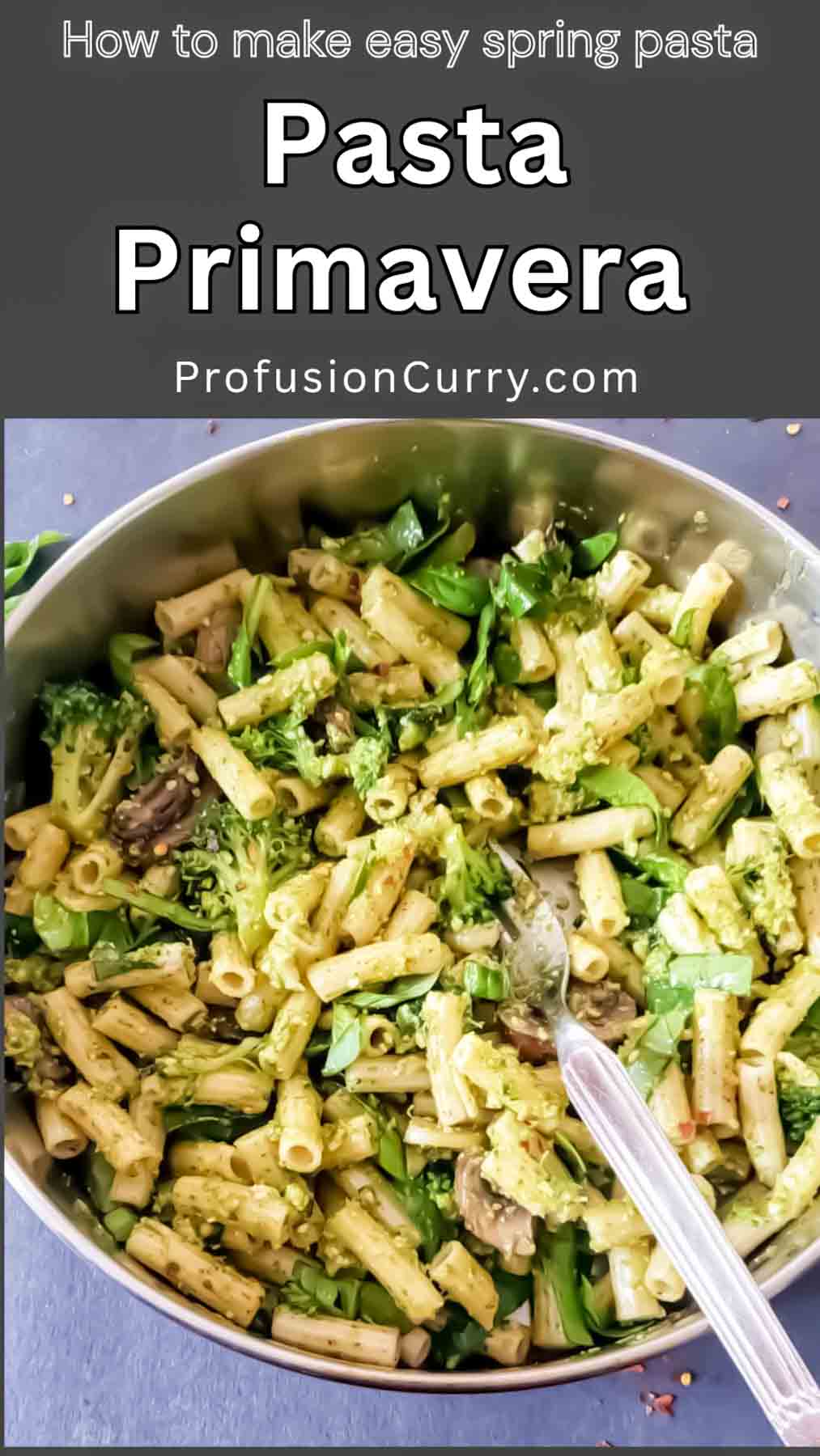 Overhead shot of pesto pasta primavera with colorful spring vegetables
