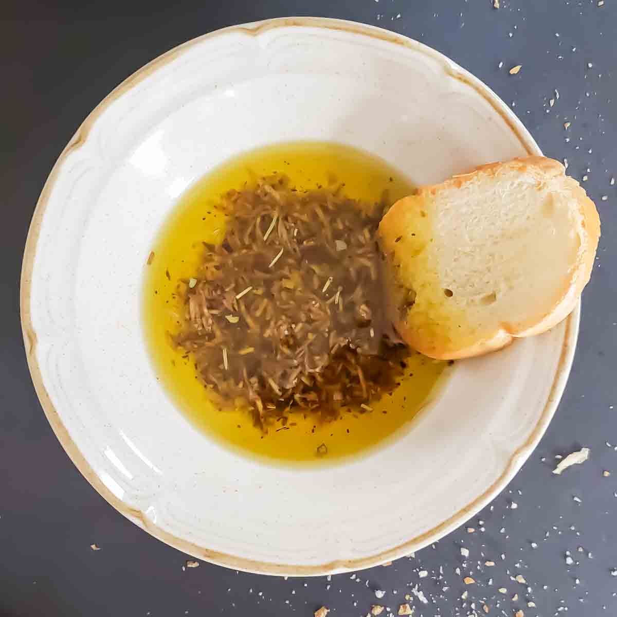 A bowl of bread dipping olive oil.