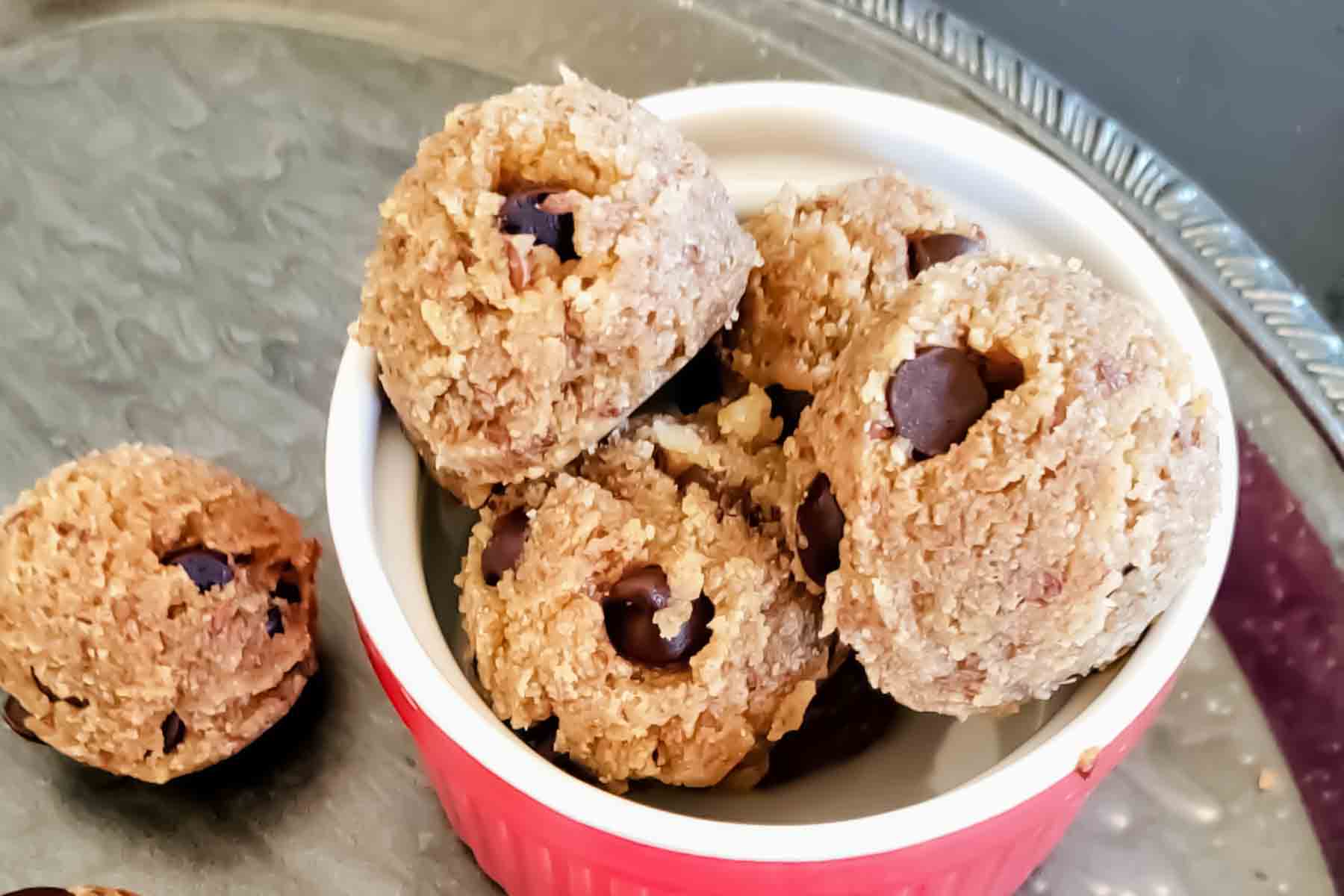 Edible cookie dough balls made with almond flour in a bowl.
