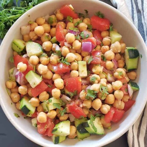 Healthy Chickpea Salad with veggies served with tangy lemon cumin dressing.