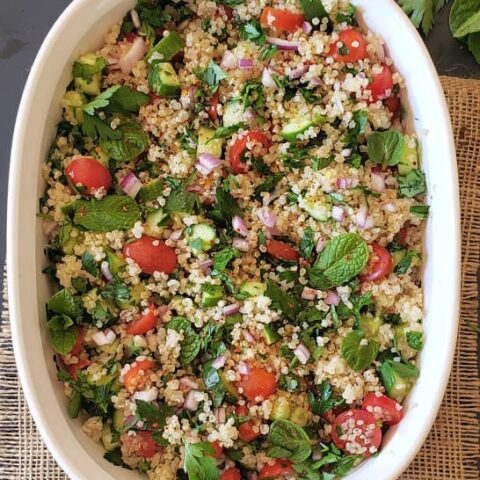 Healthy Quinoa Tabuli Salad served in a white serving bowl.