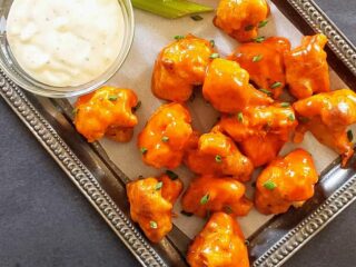 Spicy and non fried buffalo cauliflower wings served with creamy sauce. This vegetarian recipe is also gluten free and low in calorie made in air fryer.