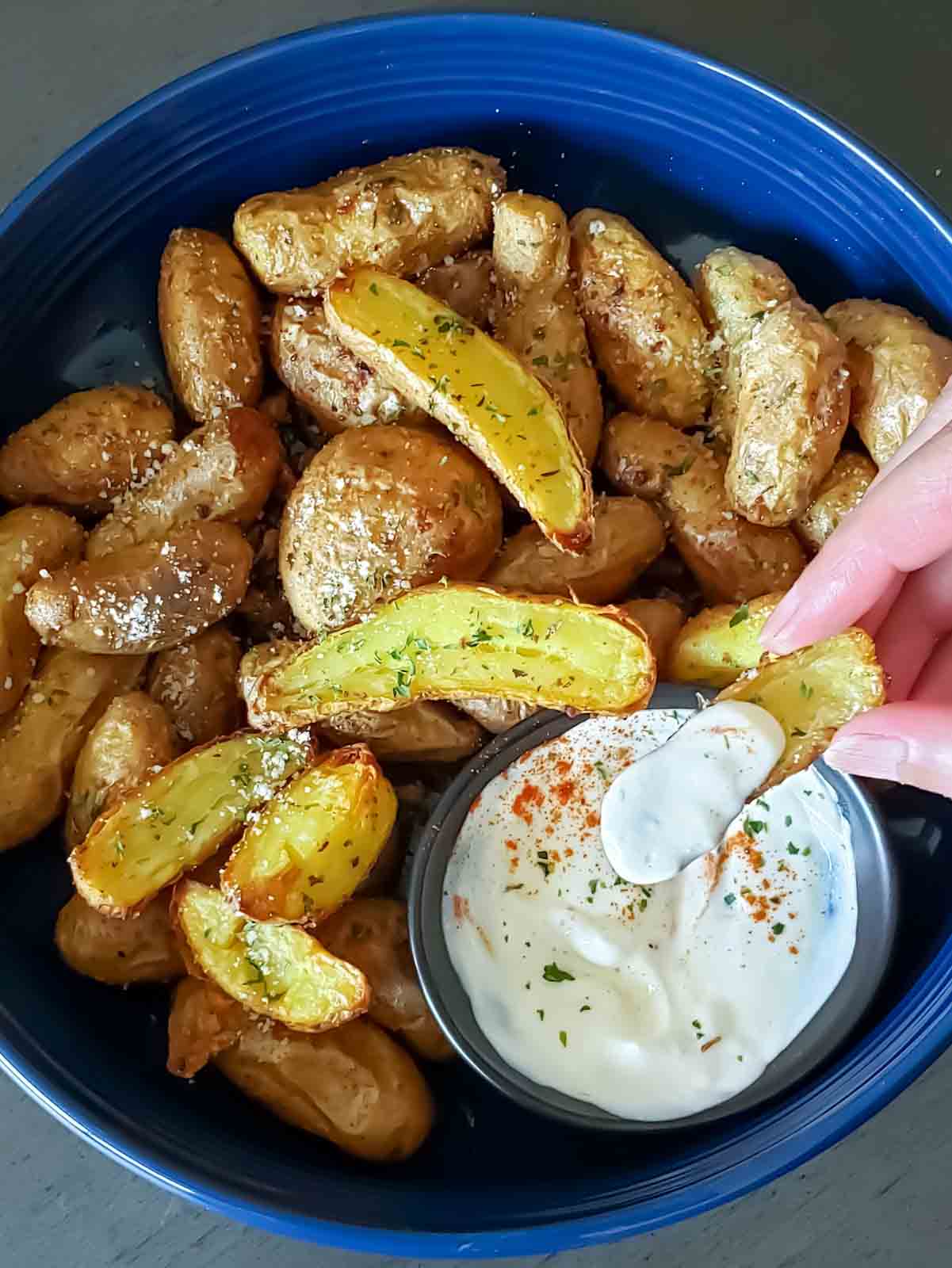 Crispy roasted air fryer fingerling potatoes served with ranch dip.