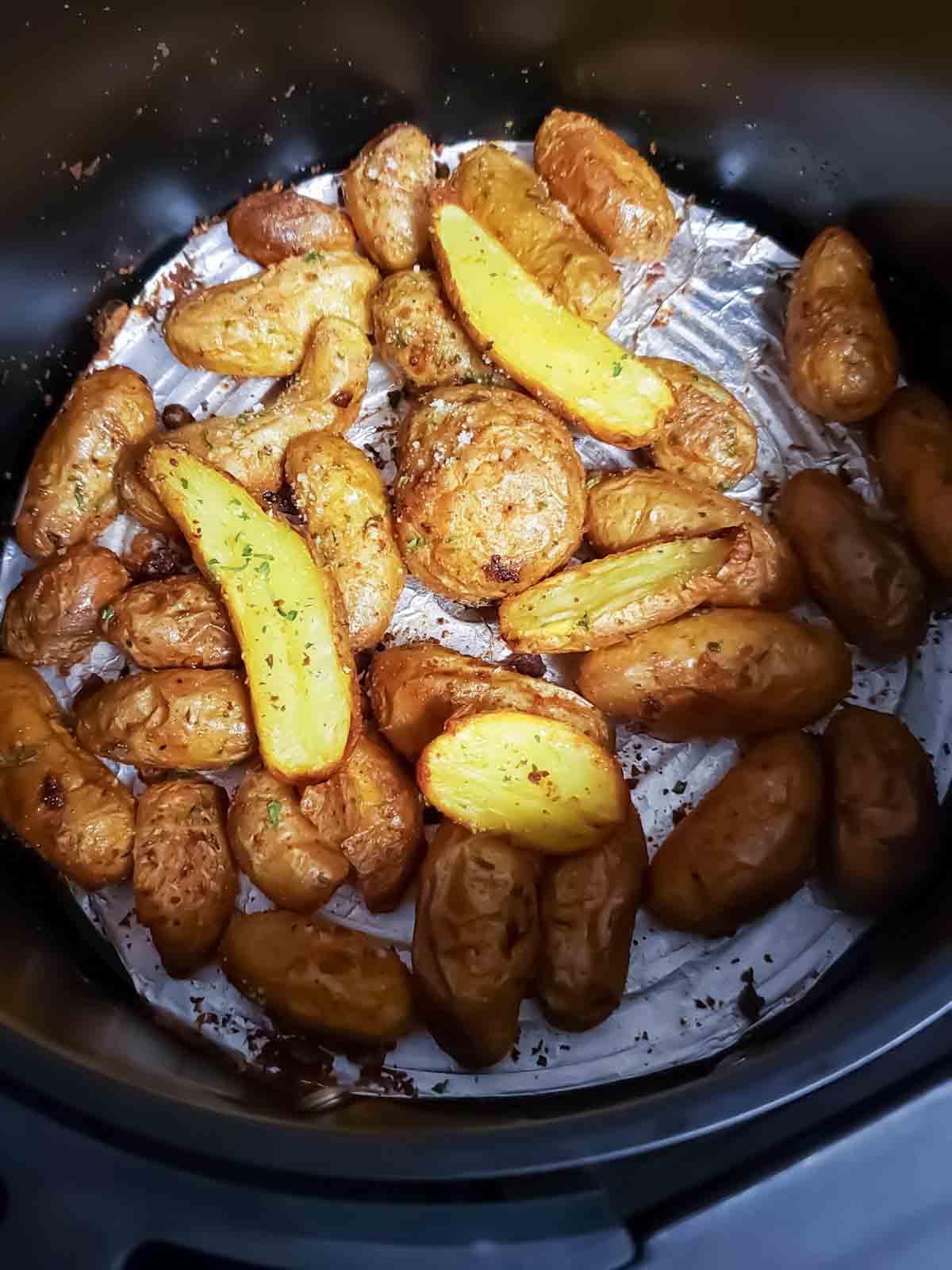 Process shot number 3 where potatoes are roasted to golden brown in air fryer.