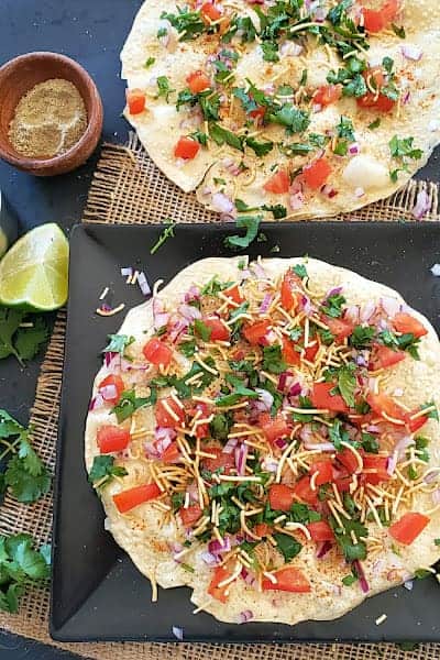 Vegan and gluten free masala papad served as an appetizer.