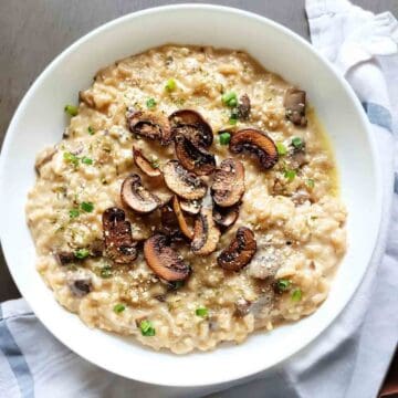 Creamy risotto made easy in Instant Pot with mushrooms served for restaurant quality family dinner.