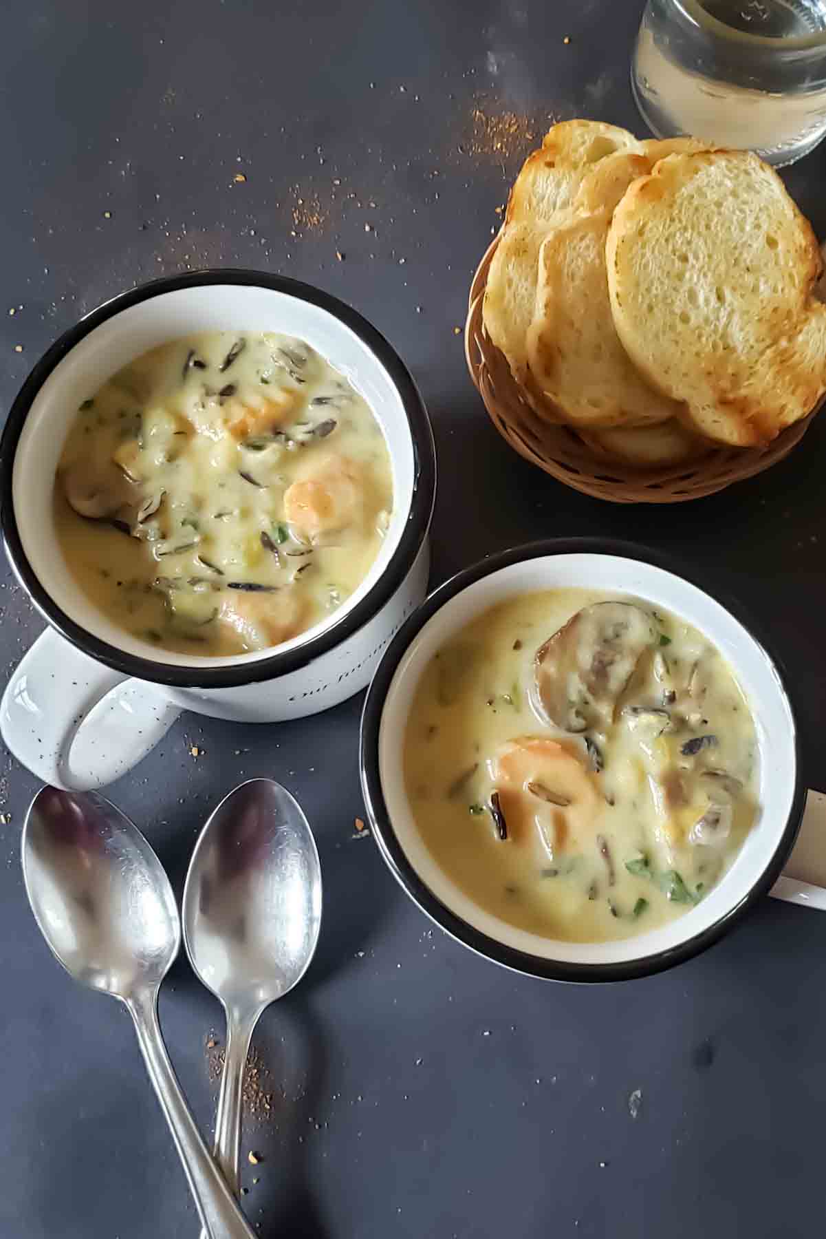 Instant Pot wild rice soup with mushrooms and vegetables in the bowls for cozy weeknight meal.