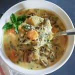 One pot wild rice soup with carrots, celery, mushrooms, and spinach.