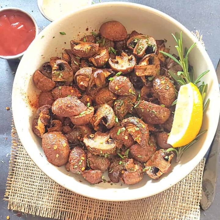 Air Fryer Mushrooms roasted to perfection and served with garnishes.