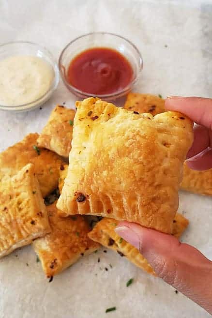 Crispy buttery mushroom mix filled puff pastry square.