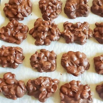 3 ingredient peanut clusters made with chocolate and roasted peanuts for delicious no-bake holiday treat.