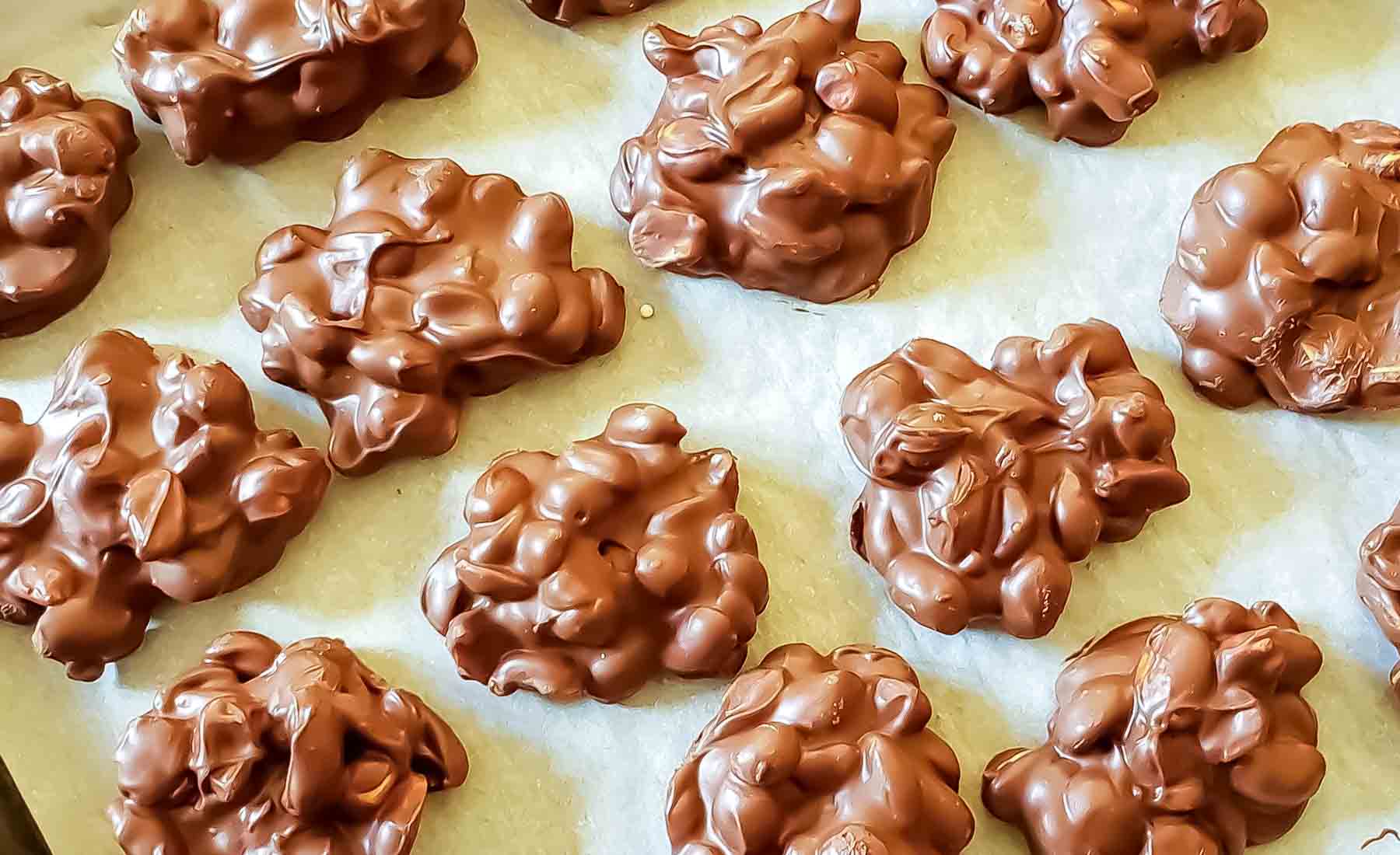 No bake peanut clusters with dark chocolate, milk chocolate, and roasted peanuts.