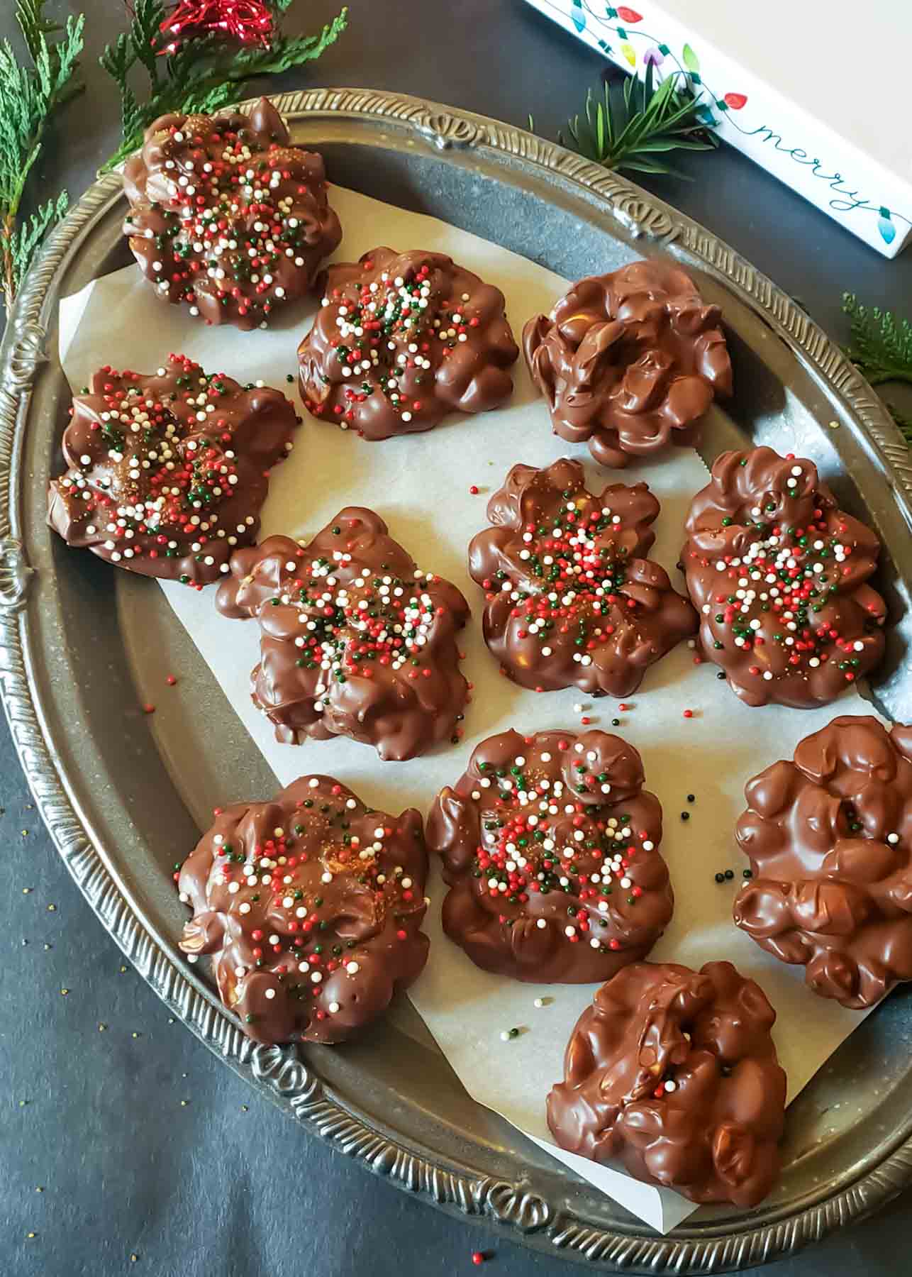 3 ingredient peanut clusters made with chocolate and roasted peanuts.