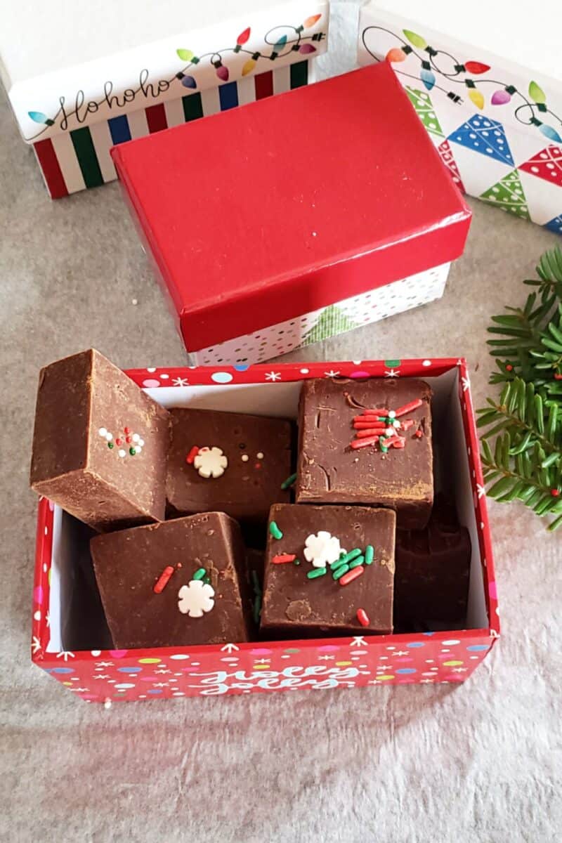 A holiday box full of chocolate fudge prepared for gifting.