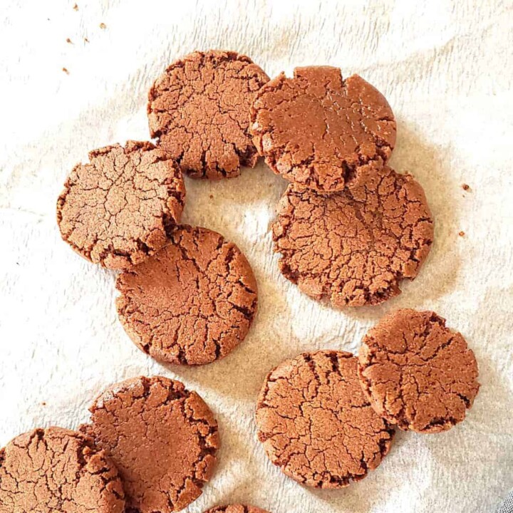 Vegan and gluten free chocolate coffee cookies which are mocha cookies arranged on baking tray.