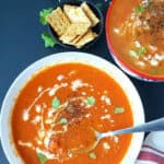 Pinterest image with text overlay for healthy carrot ginger soup made in Instant Pot with just seven ingredients