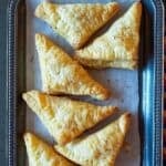 Sweet coconut pastry triangles made with puff pastry and condensed milk and baked in air fryer.