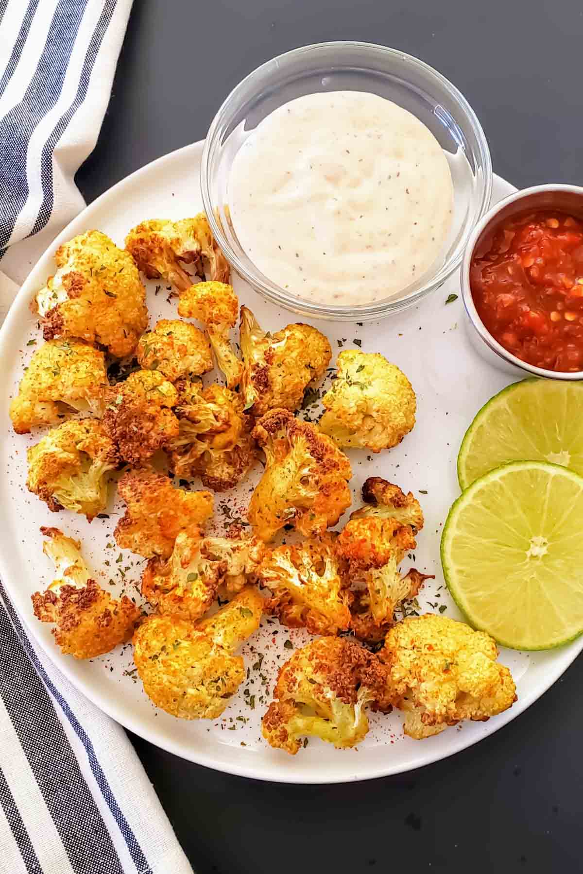 Air fryer curry cauliflower which is Indian spiced cauliflower, served as a healthy side dish or snack.