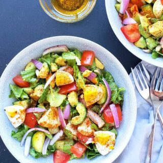 Close up image showing all the colorful veggies and hard boiled eggs used in this making this scrumptious salad.