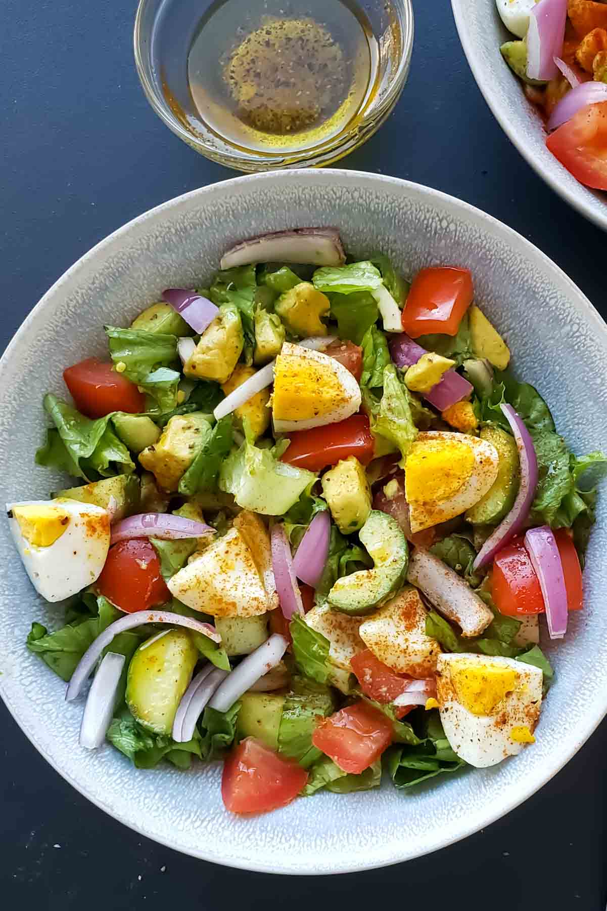 A bowl of nourishing and hearty mayo free avocado egg salad.
