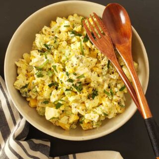 A bowl filled with creamy egg salad .