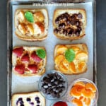 Pinterest image with text overlay for Tiktok toast recipe which is yogurt toast made with custard and fruits in the air fryer or oven.