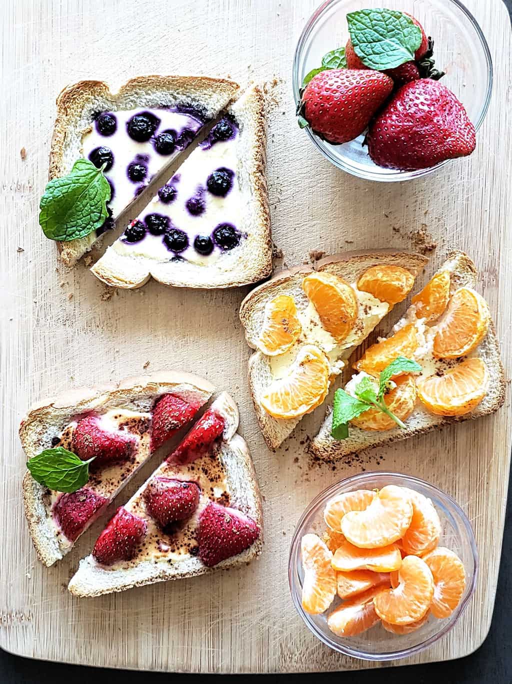 Six different tiktok toasts which are custard yogurt toasts served with different fruits and toppings.
