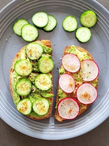 Avocado Toast shown with different variations. Here it is topped with fresh cucumber and radish slices and chili lime seasoning.