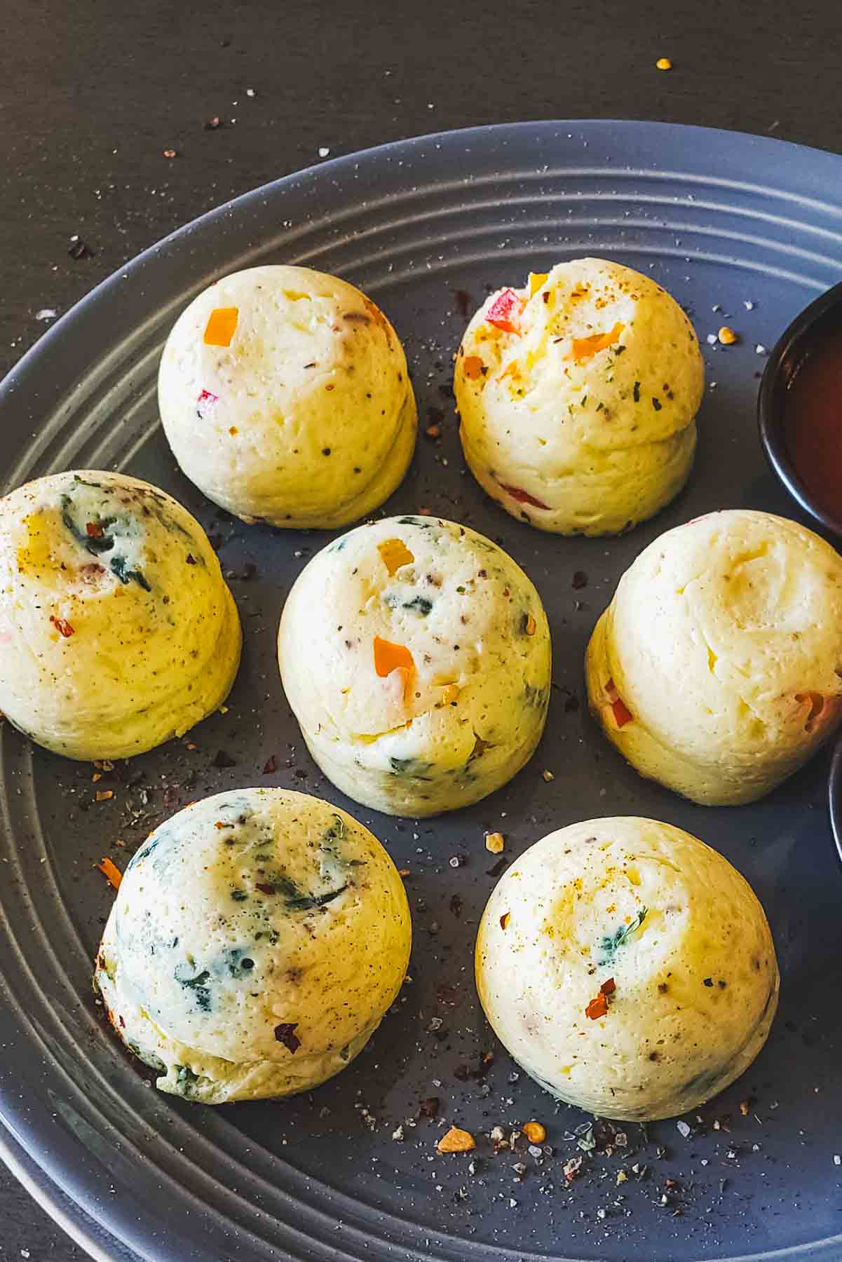 Egg bites with cottage cheese served on a plate for a low carb high protein vegetarian breakfast.